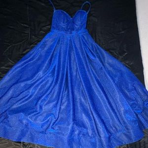 Blue glitter Cinderella gown with a corset in the back of it.